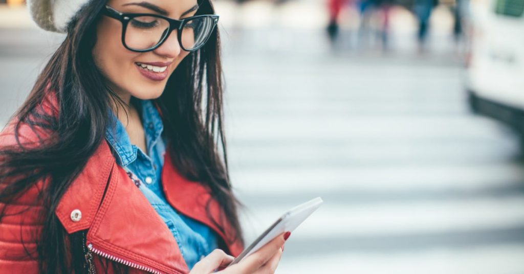 young woman searching on her phone