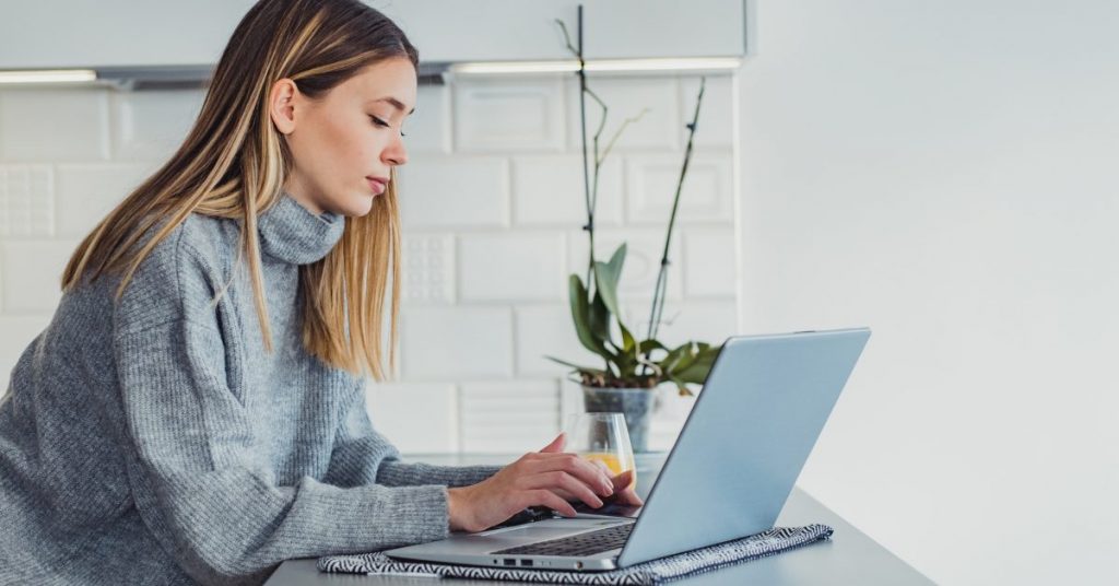 woman searching for abortion pill online on her laptop