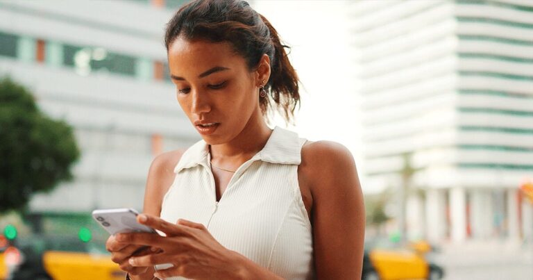 Woman using her smartphone to search for information with AI-powered search results.
